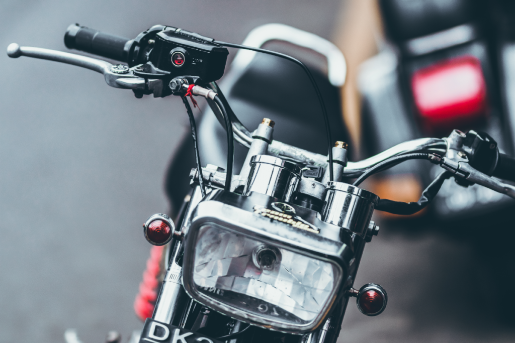 Headlight of a small commuter motorcycle.